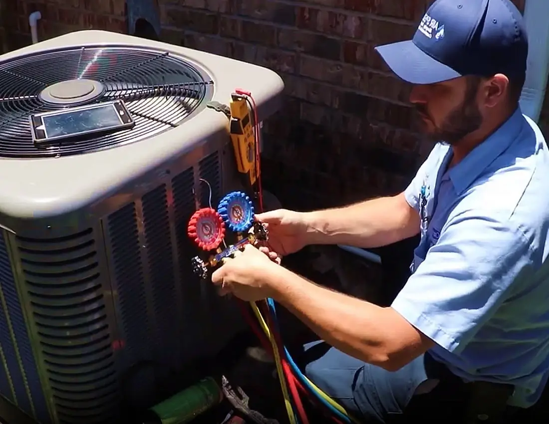 AC Heating HVAC Technician Repairing Unit