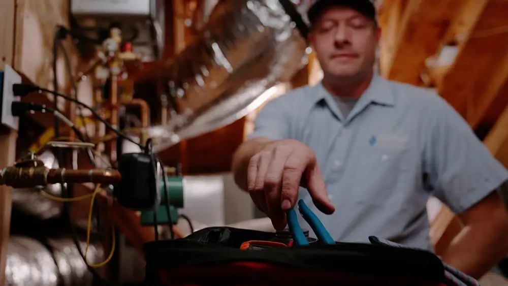 Plumber repairing a sink