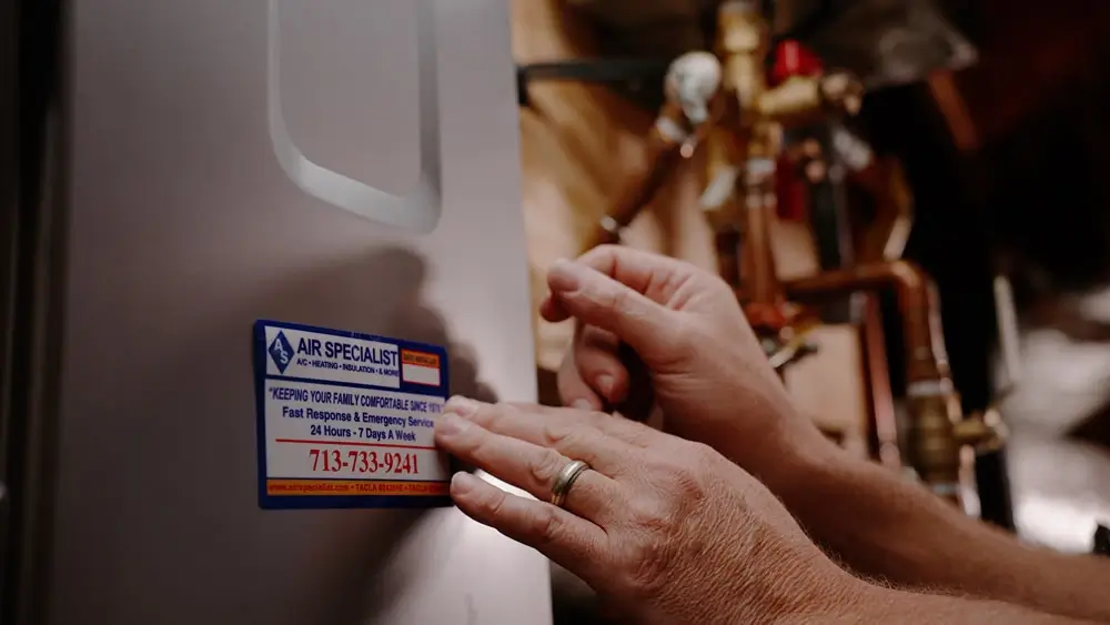 Technician adjusting a water heater