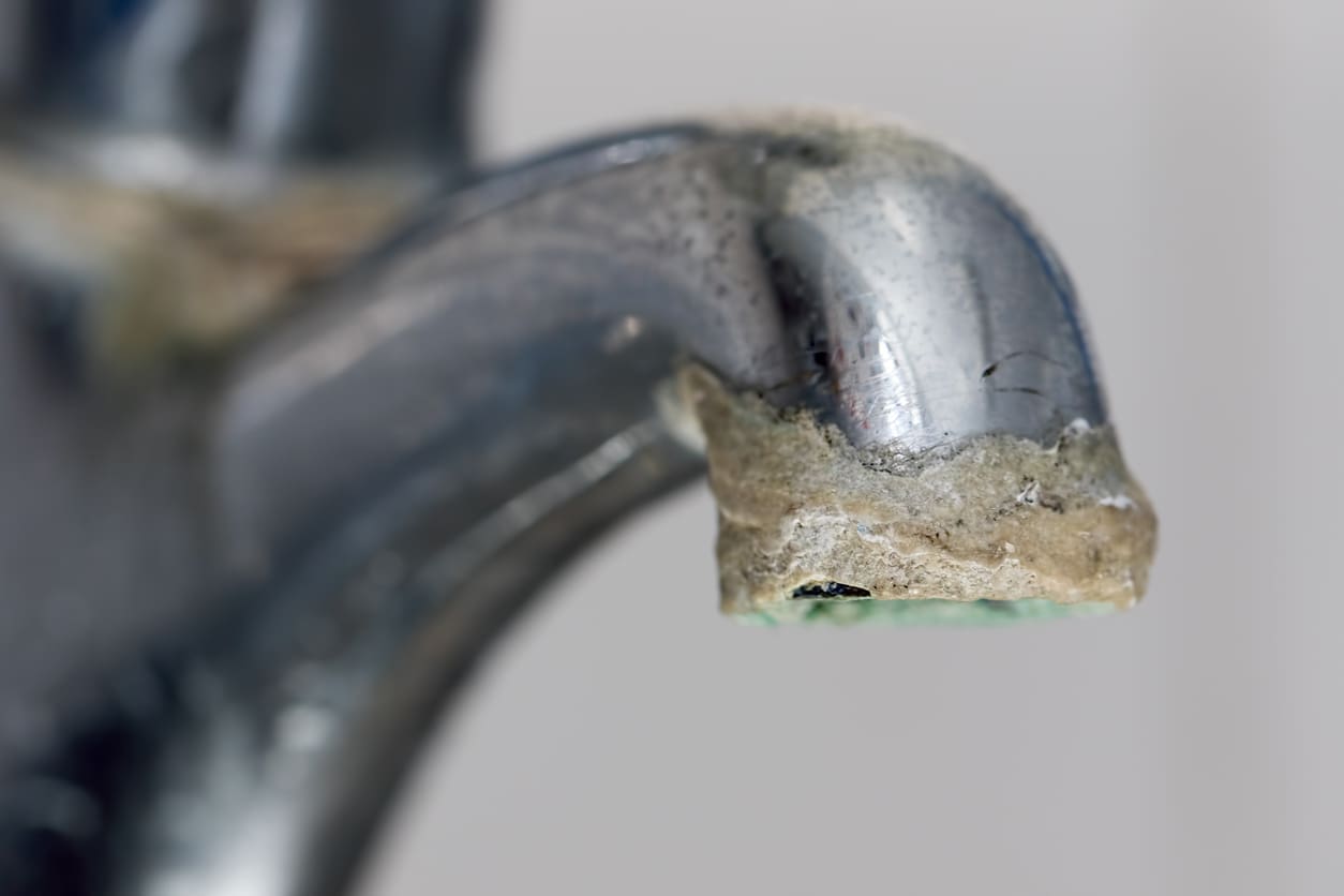 a water softener can prevent against calcium buildup from appearing on the end of a faucet
